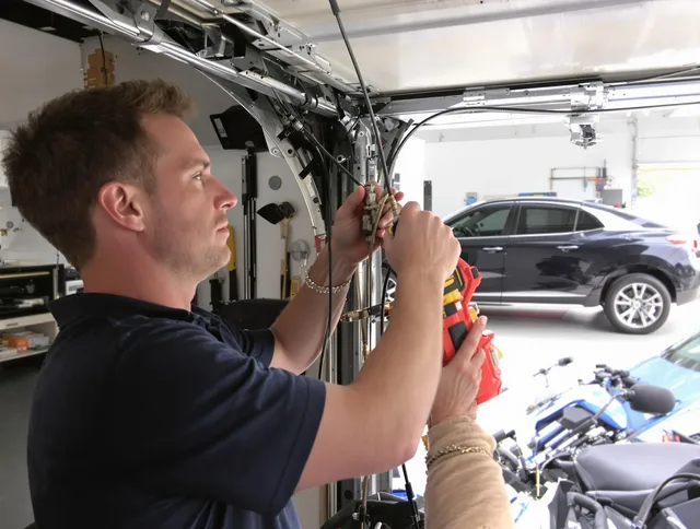 Weston Garage Door Repair safety certified technician performing cable replacement in Weston