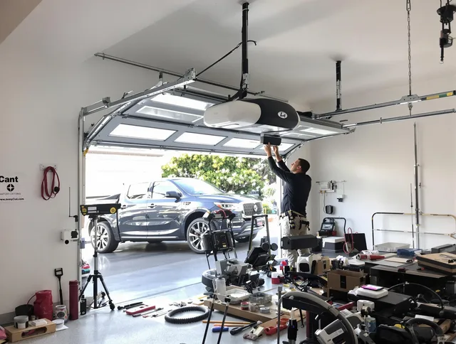 Weston Garage Door Repair specialist installing smart garage door opener system in Weston home